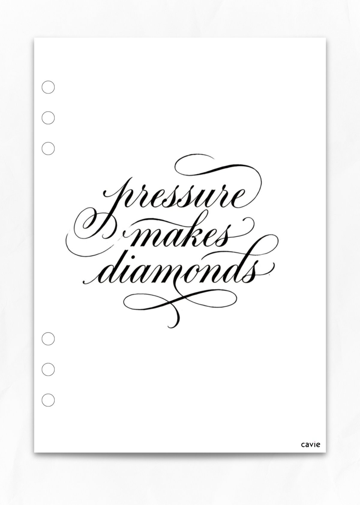 A white planner insert sheet with black calligraphy text reading 'pressure makes diamonds' and five punched holes along the left edge. Small 'cavie' branding appears in the bottom right corner.
